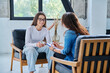 © Valerii Honcharuk - Young smiling girl patient in therapy session with social mental therapist