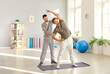 © Studio Romantic - Therapist assists a patient with stretching exercises during a physiotherapy session, focusing on rehabilitation and physical recovery. Support and medicare provided during the recovery process.