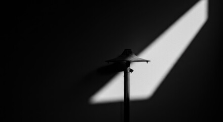 Fototapete - Dramatic Black and White Lamp with Striking Light and Shadow