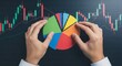 © Merch_Ai - Hands arranging colorful pie chart over stock market candlestick graph candlestick chart financial data