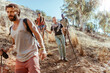© Marko Geber - Young and diverse group of friends and hikers hiking together in the mountains of south africa