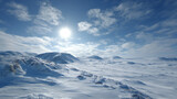 A vast snowy landscape under a bright sun, showcasing serene beauty with rolling hills and a clear blue sky.