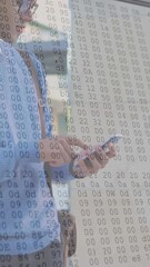 Poster - Animation of numbers changing and data processing on computer screens over man using smartphone