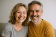 © Generative AI - Happy middle-aged couple smiling warmly indoors with bright natural lighting and casual clothing.