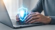 © LYKASTOCK - Secure digital protection with hands typing on laptop