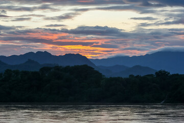 Wall Mural - mountain and lake sunset landscape with a beautiful evening sky in luang prabang