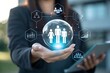 © shu_mad - Businessman holding digital icons of people and team management, representing human resources, recruitment, employee data, business leadership, and digital HR solutions.
