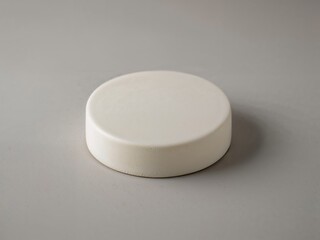 Poster - Sophisticated Presentation, A Sleek and Minimalist White Cake Stand for Displaying Culinary Masterpieces or Artistic Creations