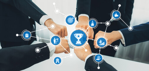 Poster - A business team celebrates their success with fist bumps, surrounded by digital icons representing achievements and connections in a modern workspace setting. Amity