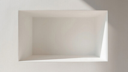 Poster - A top view of an empty rectangular recessed shelf with light and shadow on a white wall
