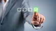 © Patel Studio - Businessman completing checklist online with digital interface and green checkmark