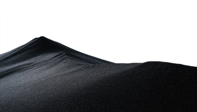 Dark sand dune against white background