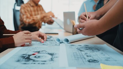 Poster - A vibrant team collaborates in a sleek office environment, engaging in a productive discussion over blueprints and digital tools to foster innovative ideas. SACTR