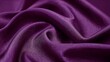 © Ravindu - Close up shot of draped purple satin fabric with soft folds and subtle sheen for a luxurious texture