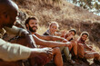 © Marko Geber - Group of young hikers taking a break to rest while hiking in the mountains in south africa