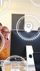 Poster - Animation of icons over happy caucasian female coworkers looking into computer and giving high five