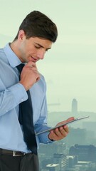 Poster - Composite view of businessman using digital tablet against aerial view of cityscape