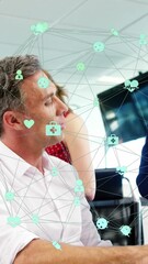 Poster - Animation of connected icons forming globe over diverse coworkers working in office