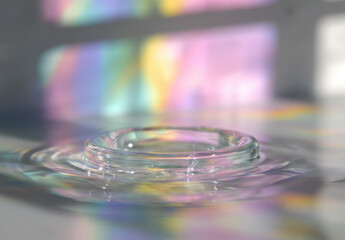Aufkleber - Smooth ripple circle on table with off center echo, soft pastel colors, abstract water reflection, tranquil mood, sunlight, minimalistic style, close up