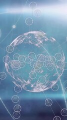  - Animation of digital icons over spinning globe and light spot against blue background