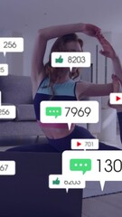 Fototapete - Animation of media icons over caucasian woman exercising at home