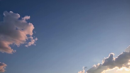 Wall Mural - Expansive 4K timelapse video of a clear blue sky with rolling white clouds moving gracefully at the Thai Malaysian border showcasing natural weather phenomena and serene sky beauty for various