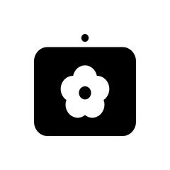 Fototapete - Black rounded square with a white flower in the center and a black circle above it on a white background