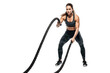 © AuroraCrafts - Focused Female Athlete Performing Battle Ropes Exercise During High-Intensity Workout