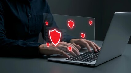 Poster - Man typing on a laptop with firewall shield icons. Cybersecurity and data protection digital concept. Computer safety footage.