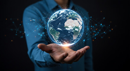 Wall Mural - Glowing digital Earth held by a hand, depicting worldwide communication and a vision for the future