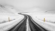© Molka - A winding road cuts through a snowy, mountainous landscape with minimal visibility due to fog and snow coverage.