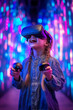 © Kmikhidov - A child girl wearing a black VR headset smiles joyfully while gripping game controllers tightly. Surrounded by colorful blue and purple neon lights, the studio creates an immersive atmosphere