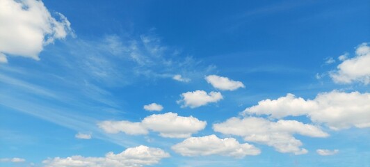 Wall Mural - Sky panorama clear blue with white clouds in spring. Cloudscape