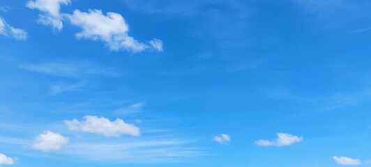 Wall Mural - Sky panorama clear blue with white clouds in spring. Cloudscape