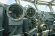 © DenisProduction.com - Close-up of vintage navigation instruments inside a ship's bridge. Compass dials and mechanical controls are surrounded by steel panels and wiring.