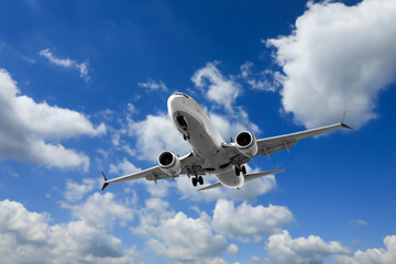 Wall Mural - airplane flying in beautiful blue sky with clouds
