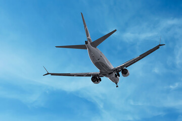 Wall Mural - airplane flying in beautiful blue sky with clouds