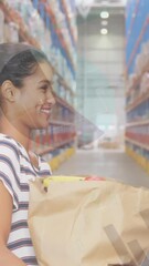 Poster - Statistical data processing over african american woman donating bag to male volunteer at warehouse