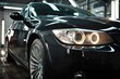 © Serhii - Shiny Black Automobile: Expert Car Polish Service for Pristine Vehicle Appearance