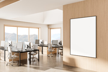 Poster - Modern office interior with blank framed poster on wooden wall and minimalist clean workspace layout illuminated by natural daylight through large windows. 3D Rendering