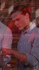 Poster - Business professionals discussing data on laptop with digital animation overlay