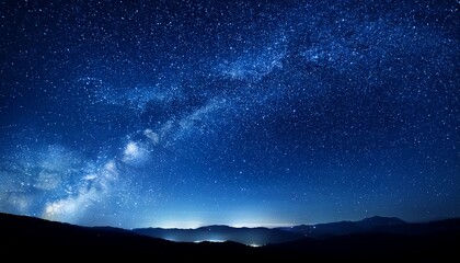 Wall Mural - a starry night sky with a blue background