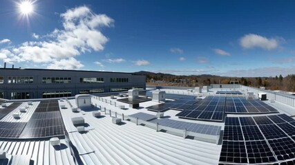 Building rooftop solar panels generate energy sunny landscape mountain backdrop