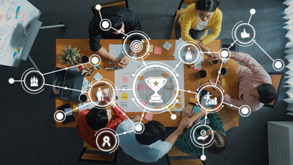 Poster - Overhead view of a diverse team collaborating in a business meeting, surrounded by technology and networking icons, showcasing innovation and strategic planning processes. Amity