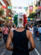 © Guillermo - Hombre camina en festividades nacionales del mes de septiembre en México, con una peluca con la bandera mexicana estampada.