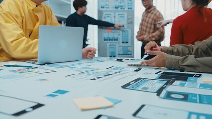 Poster - A vibrant workspace showcases a creative team engaged in a digital design project. Laptops, tablets, and colorful notes create an inspiring atmosphere for collaboration. SACTR