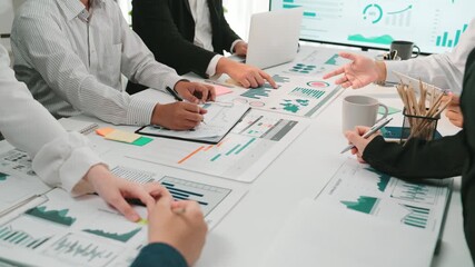 Poster - A diverse business team engages in collaborative discussions while analyzing charts and graphs in a modern office, focusing on data-driven decision-making. SACTR