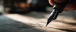 © Fernando - Closeup of a hand using a vintage fountain pen to write on parchment paper indoors, creating elegant calligraphy Concept of writing, history, and classic literature