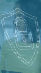 Poster - Animation of dots forming padlock in shield over diverse coworkers discussing in office