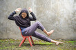 © Fajar - hijab woman active situp in the yard. easy exercise for housewives. exercise without the gym